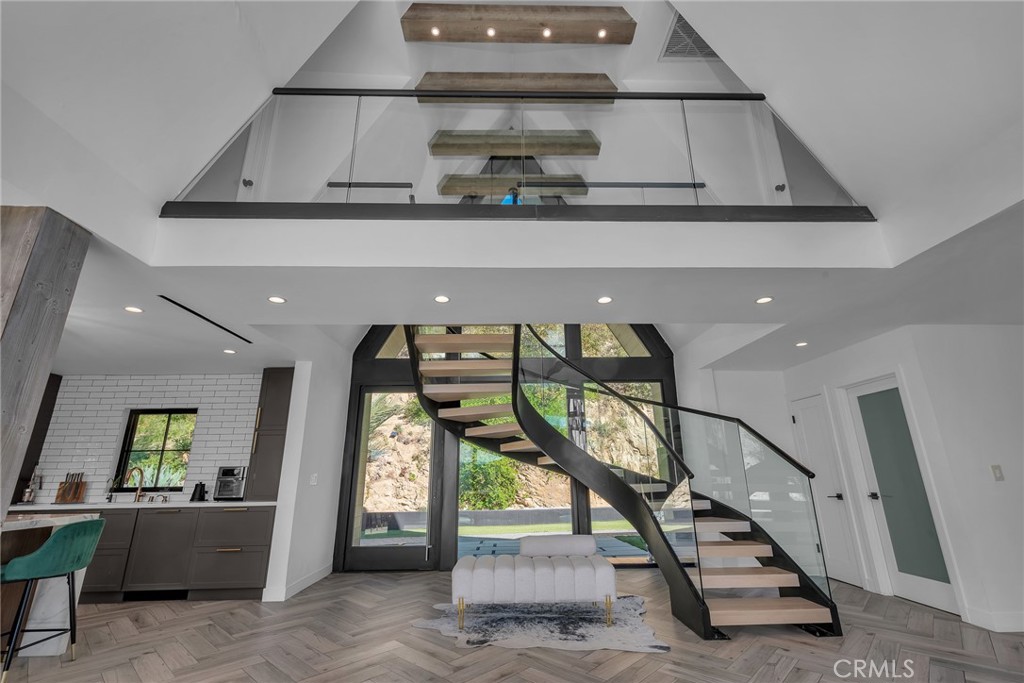 24301 Sylvan Glen Road Calabasas, CA 91302 - Photo 22 of 64 a view of entryway and hall with wooden floor