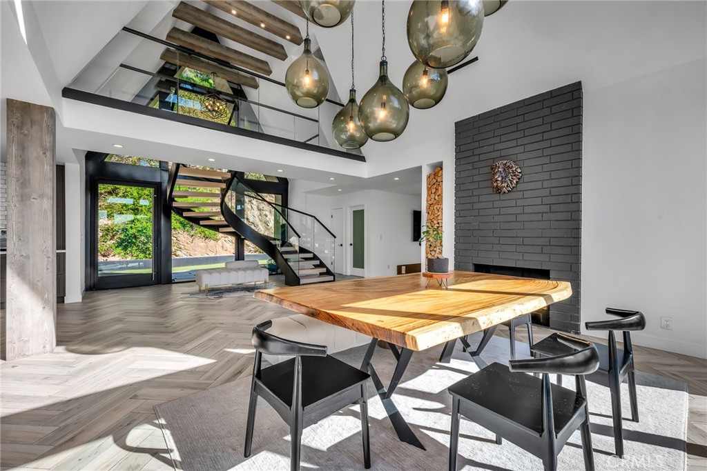 24301 Sylvan Glen Road Calabasas, CA 91302 - Photo 23 of 64 a view of a room with table and chairs