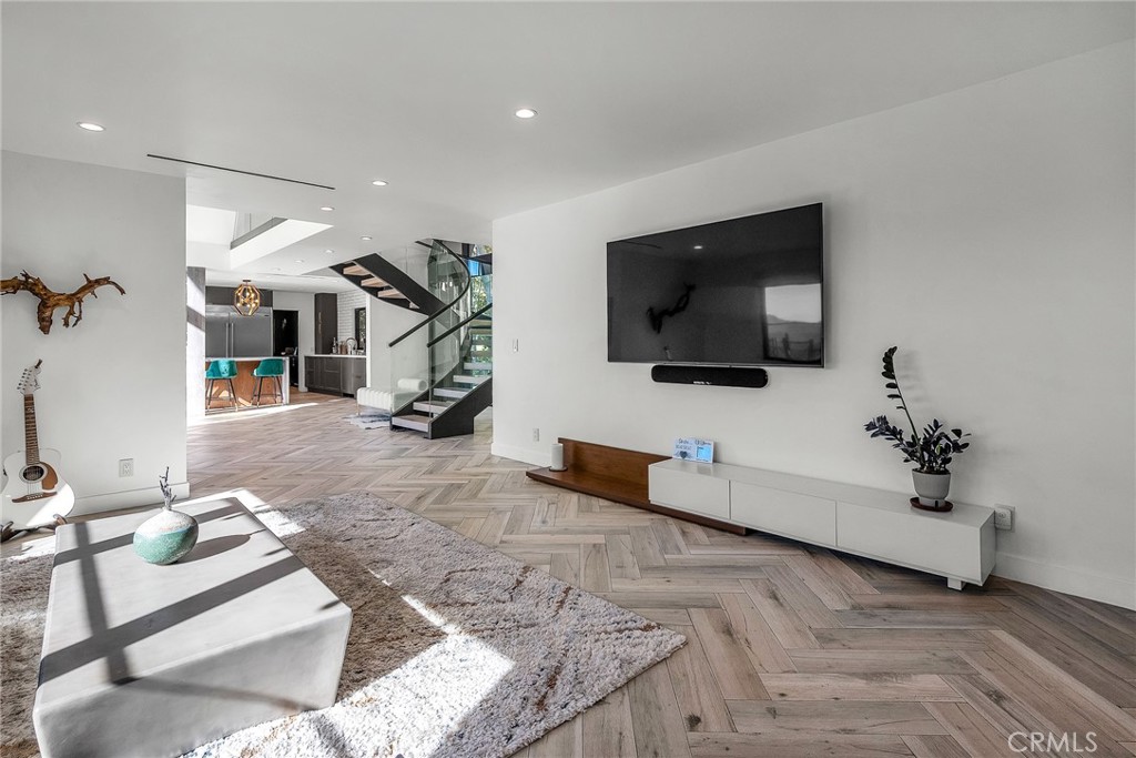 24301 Sylvan Glen Road Calabasas, CA 91302 - Photo 35 of 64 a living room with furniture and a flat screen tv