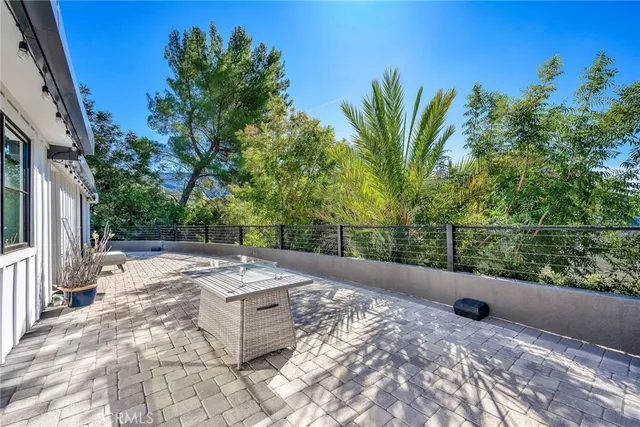 a view of a backyard with sitting area