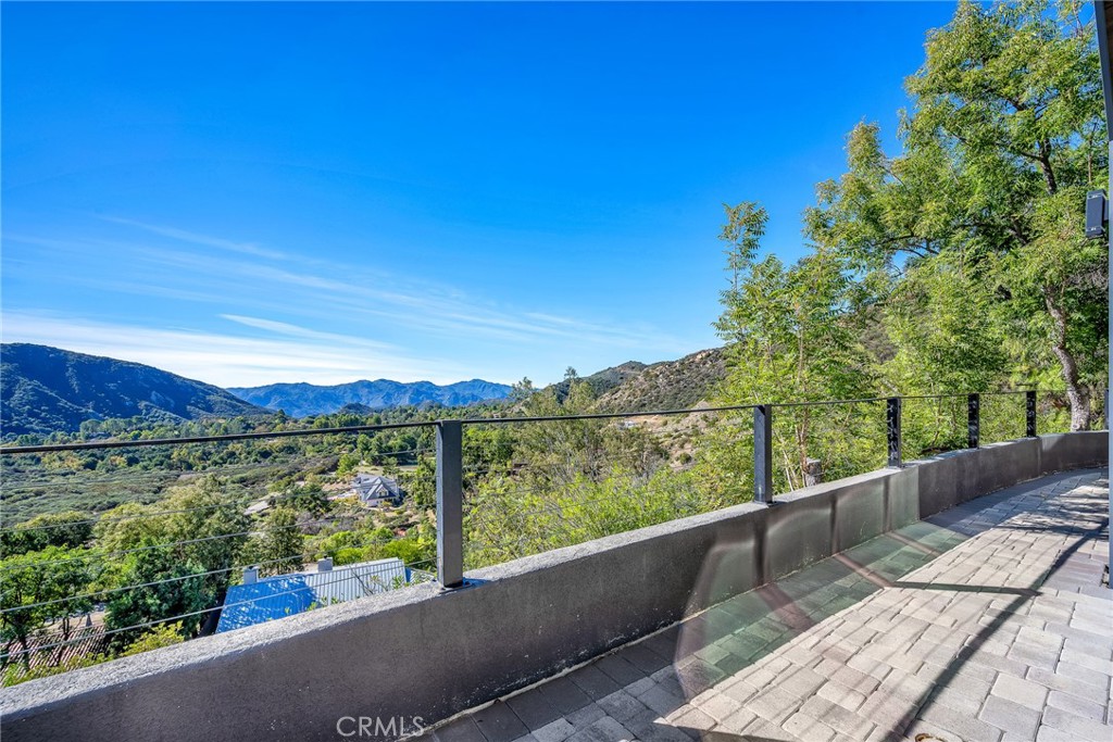 24301 Sylvan Glen Road Calabasas, CA 91302 - Photo 43 of 64 a view of balcony with mountain and ocean view