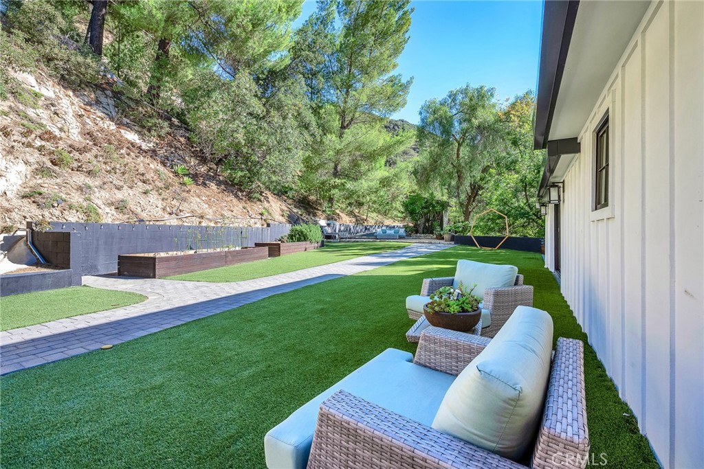 24301 Sylvan Glen Road Calabasas, CA 91302 - Photo 48 of 64 a view of garden with patio
