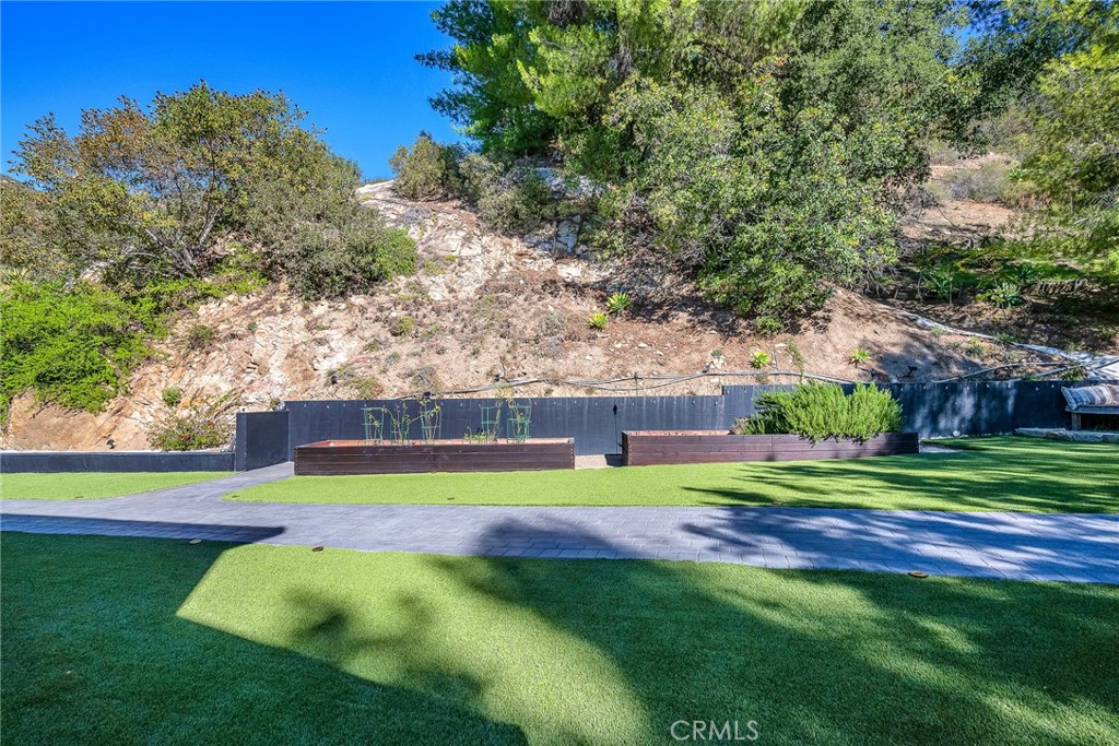 24301 Sylvan Glen Road Calabasas, CA 91302 - Photo 50 of 64 a view of a house with a big yard