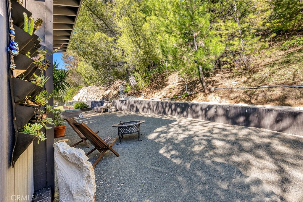 24301 Sylvan Glen Road Calabasas, CA 91302 - Photo 54 of 64 a view of a backyard with sitting area