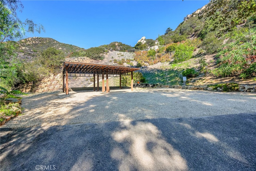 24301 Sylvan Glen Road Calabasas, CA 91302 - Photo 59 of 64 a view of a house with a mountain view