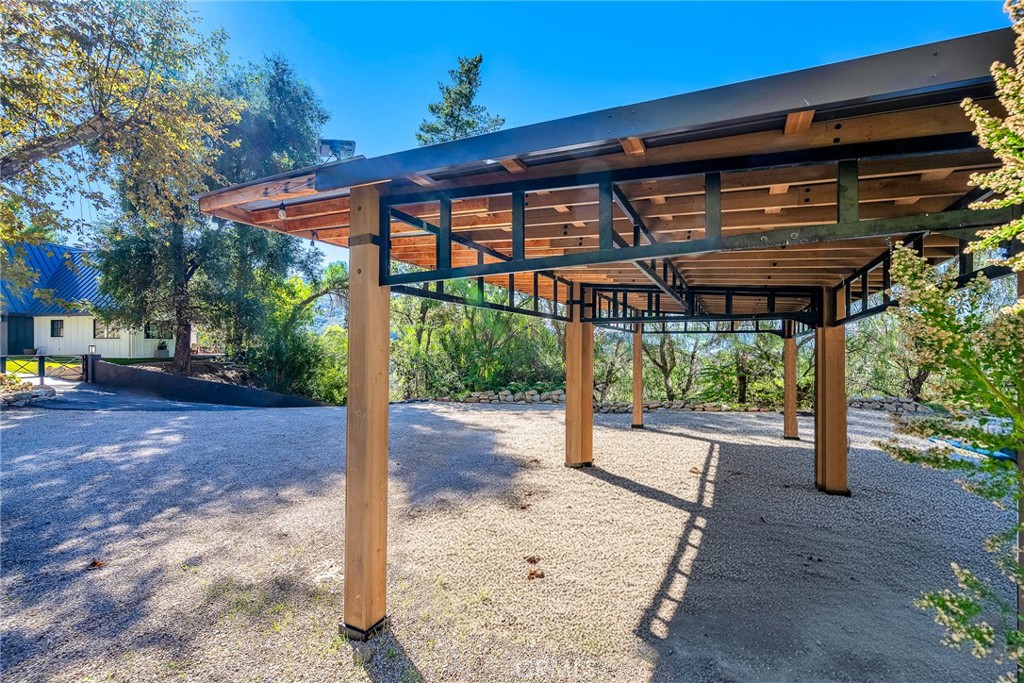 24301 Sylvan Glen Road Calabasas, CA 91302 - Photo 61 of 64 a backyard of a house with a fountain swing and table