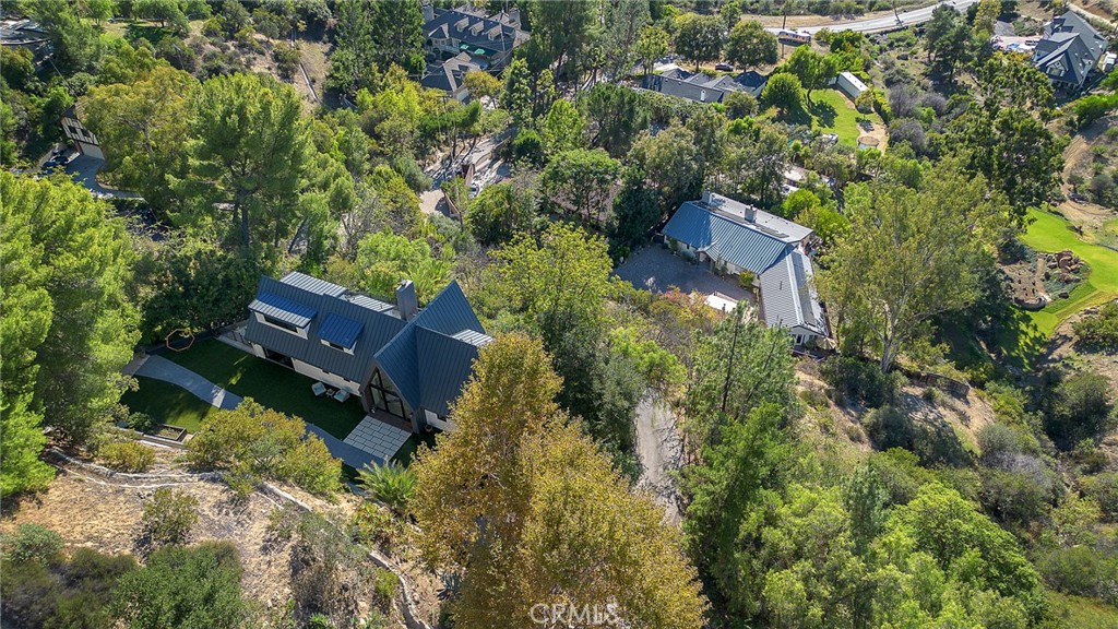 24301 Sylvan Glen Road Calabasas, CA 91302 - Photo 64 of 64 an aerial view of house with yard swimming pool and outdoor seating