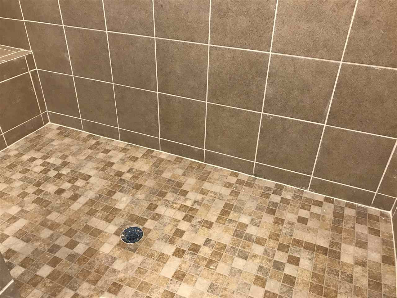 2528 Rambling Creek Road, Unit 22 Apex, NC 27523 - Photo 10 of 28 Walk-in shower with ceramic tile walls and floor. Master Bath/Spa