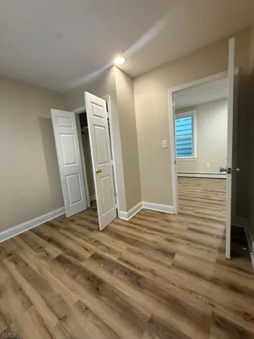 a view of a livingroom with wooden floor