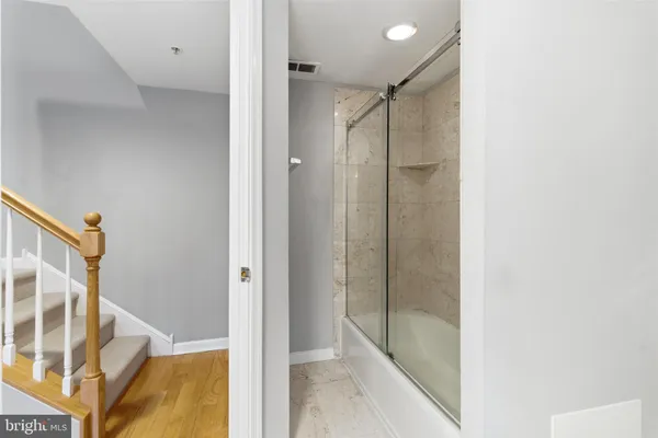 a bathroom with a toilet a sink and a mirror