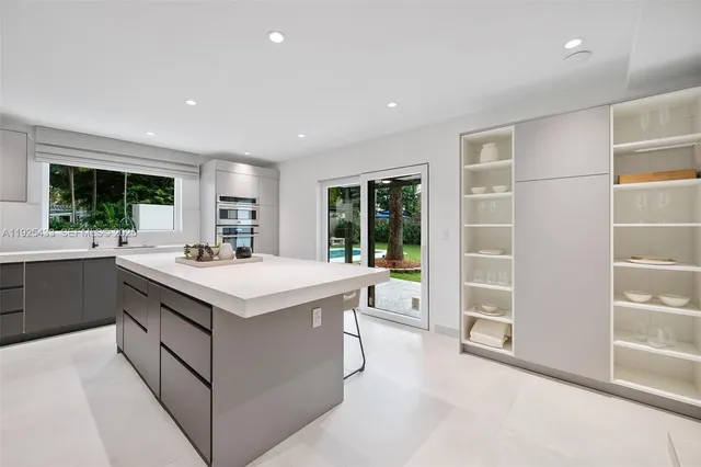 a kitchen with a stove and a sink