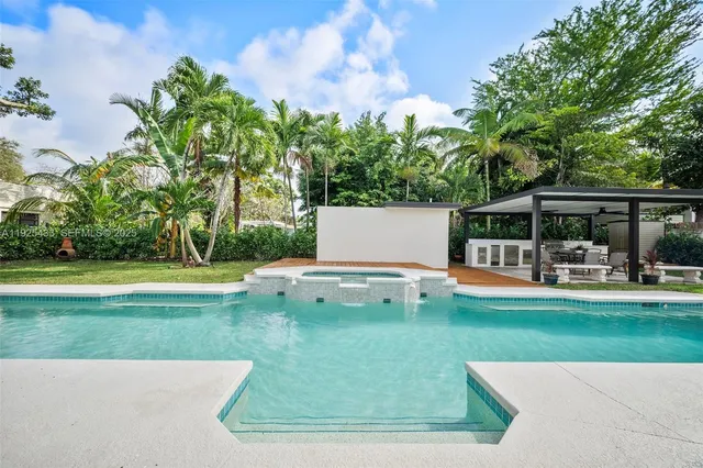 a view of a swimming pool with a patio