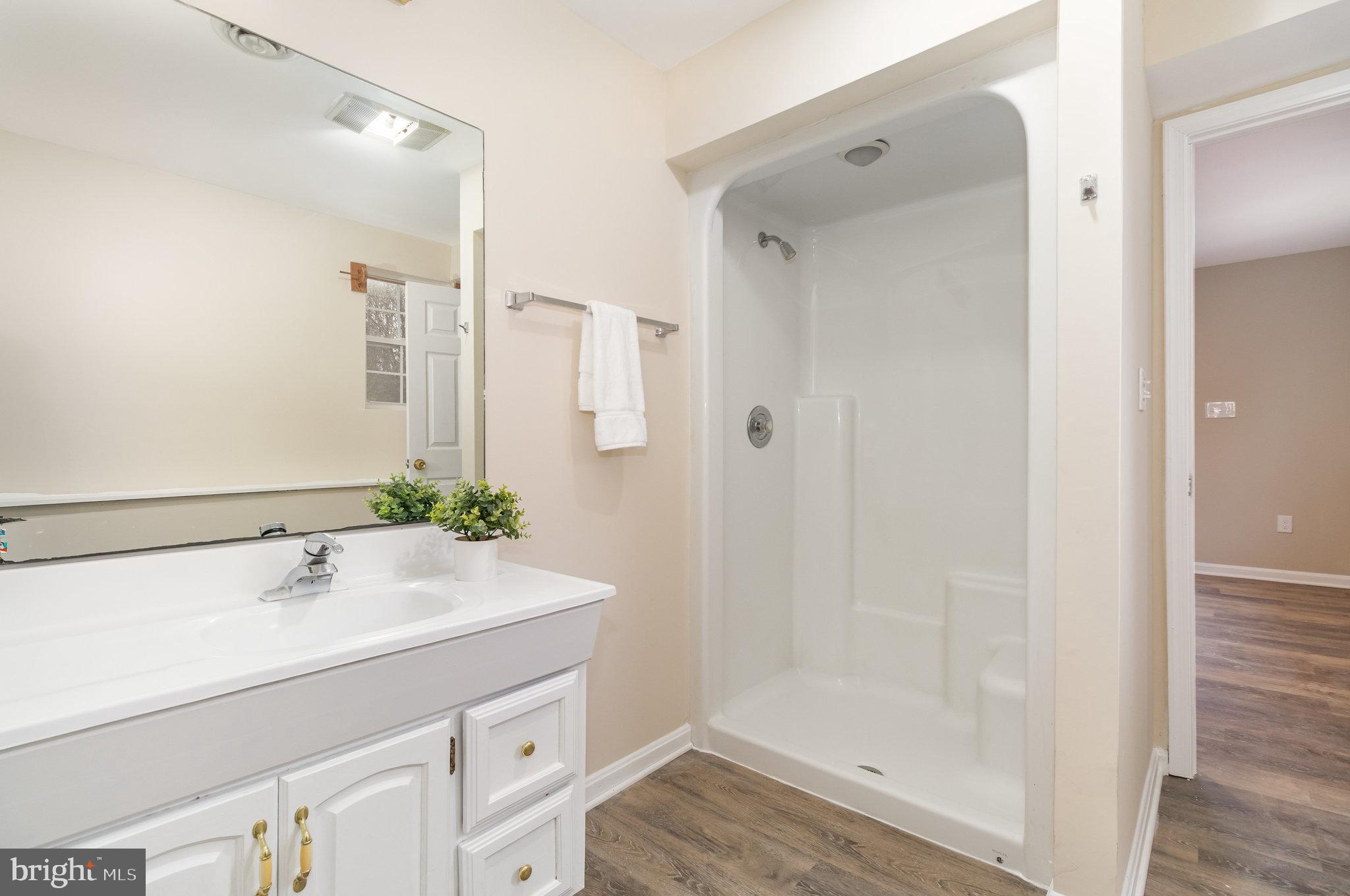 375 Meadow Trail Delta, PA 17314 - Photo 14 of 22 a bathroom with a sink and a mirror