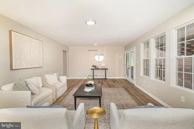 a living room with furniture and a table
