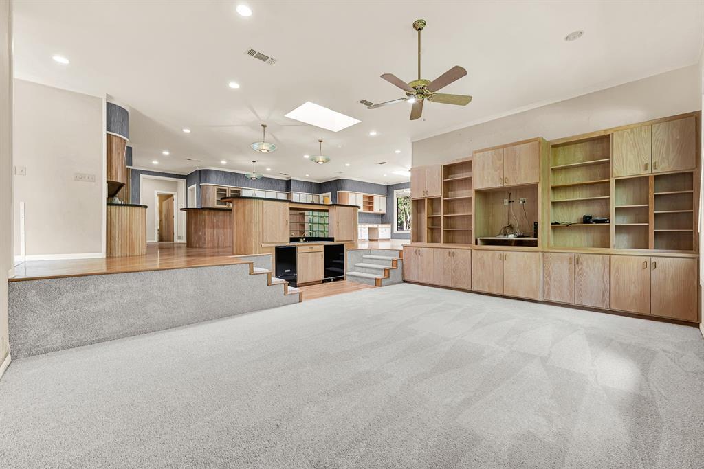 933 Mobley Road Cedar Hill, TX 75104 - Photo 40 of 40 Sunken living area w wet bar, ice machine, chiller, built in bookcases
