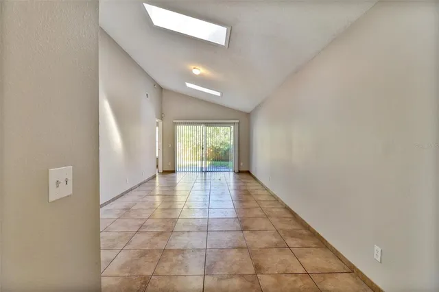 a view of an empty room and window