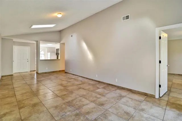 a view of an empty room and window