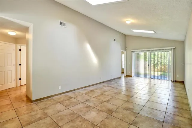 a view of an empty room and window