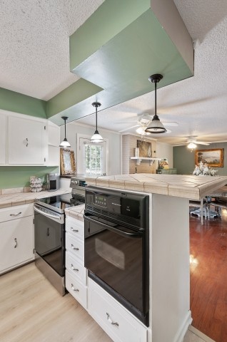 4039 Arno Road Franklin, TN 37064 - Photo 16 of 58 a kitchen with a stove and cabinets