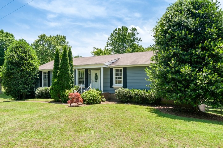 4039 Arno Road Franklin, TN 37064 - Photo 2 of 58 a front view of a house with garden