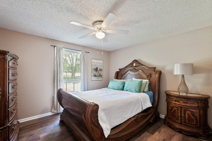 4039 Arno Road Franklin, TN 37064 - Photo 22 of 58 a bedroom with a bed and wooden floor