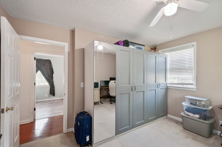 4039 Arno Road Franklin, TN 37064 - Photo 26 of 58 a hallway with a couch a chandelier and a window