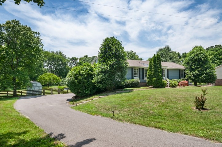 4039 Arno Road Franklin, TN 37064 - Photo 3 of 58 a view of a house with backyard and a garden