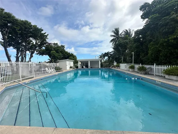 a view of swimming pool with a yard