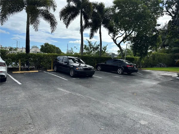a view of street with parked cars