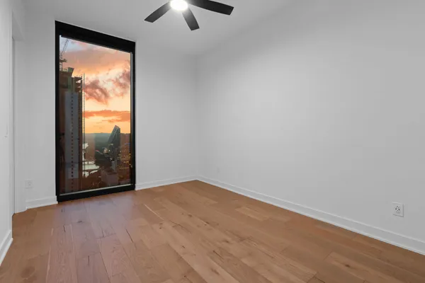 a view of a balcony with a floor to ceiling window