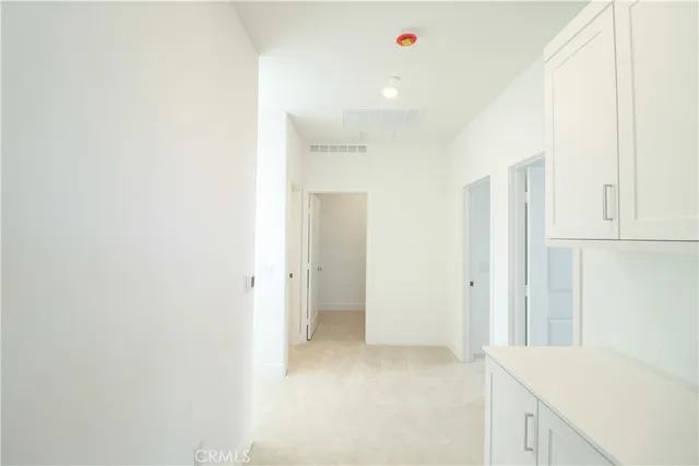 a view of hallway with kitchen island