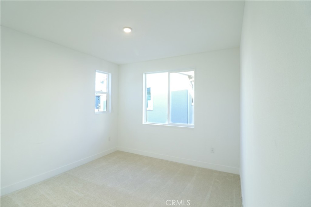 647 Gadwall Irvine, CA 92618 - Photo 21 of 29 an empty room with windows