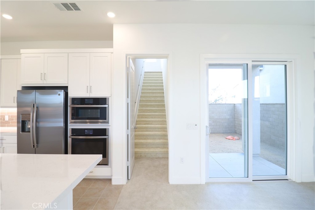 647 Gadwall Irvine, CA 92618 - Photo 22 of 29 a kitchen with stainless steel appliances a refrigerator and a sink