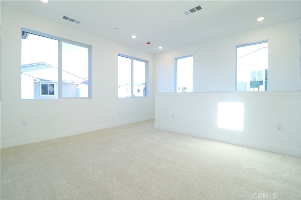 647 Gadwall Irvine, CA 92618 - Photo 27 of 29 an empty room with windows