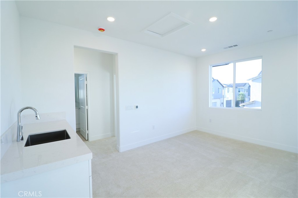 647 Gadwall Irvine, CA 92618 - Photo 28 of 29 a bathroom with a sink a vanity and a mirror