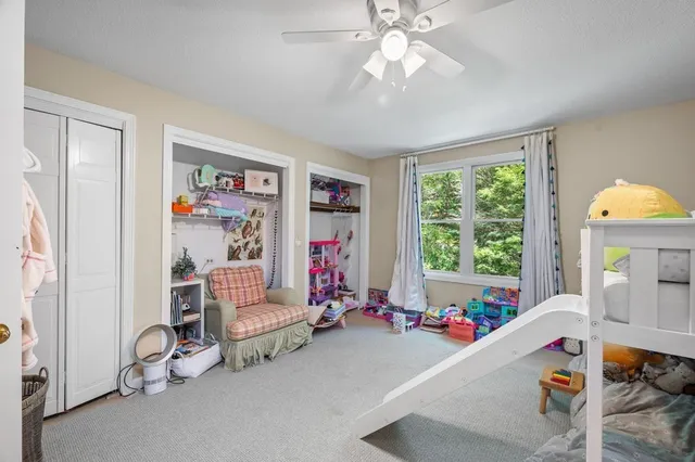 a room with furniture and a large window