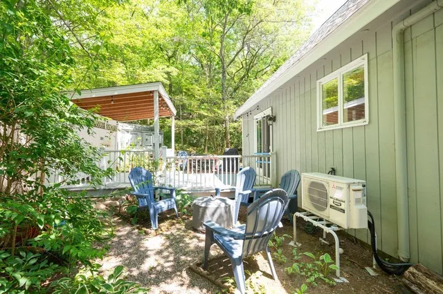 a view of a chair and table in the balcony