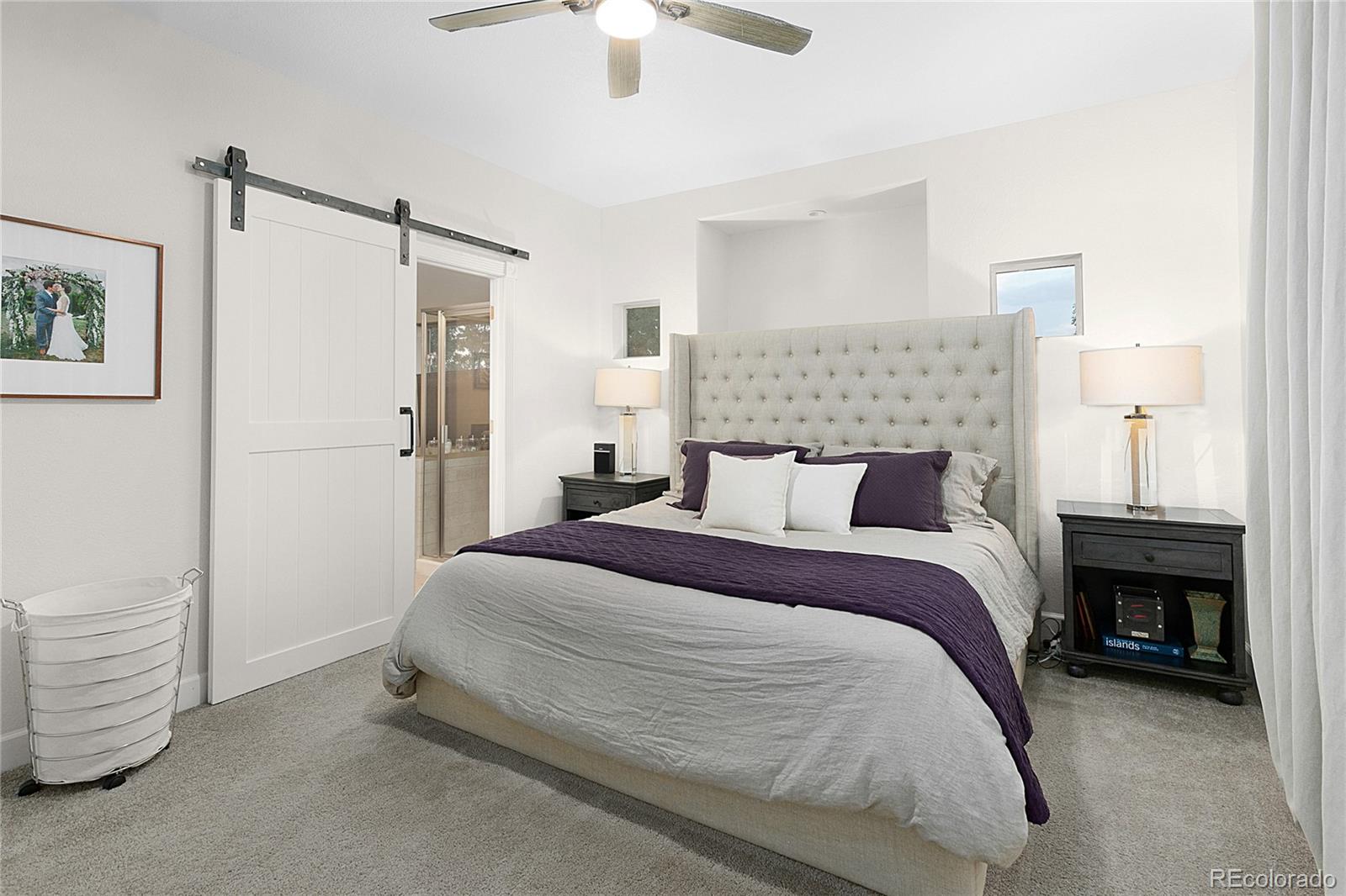 4511 Perry Street Denver, CO 80212 - Photo 13 of 36 a bedroom with a bed and a ceiling fan