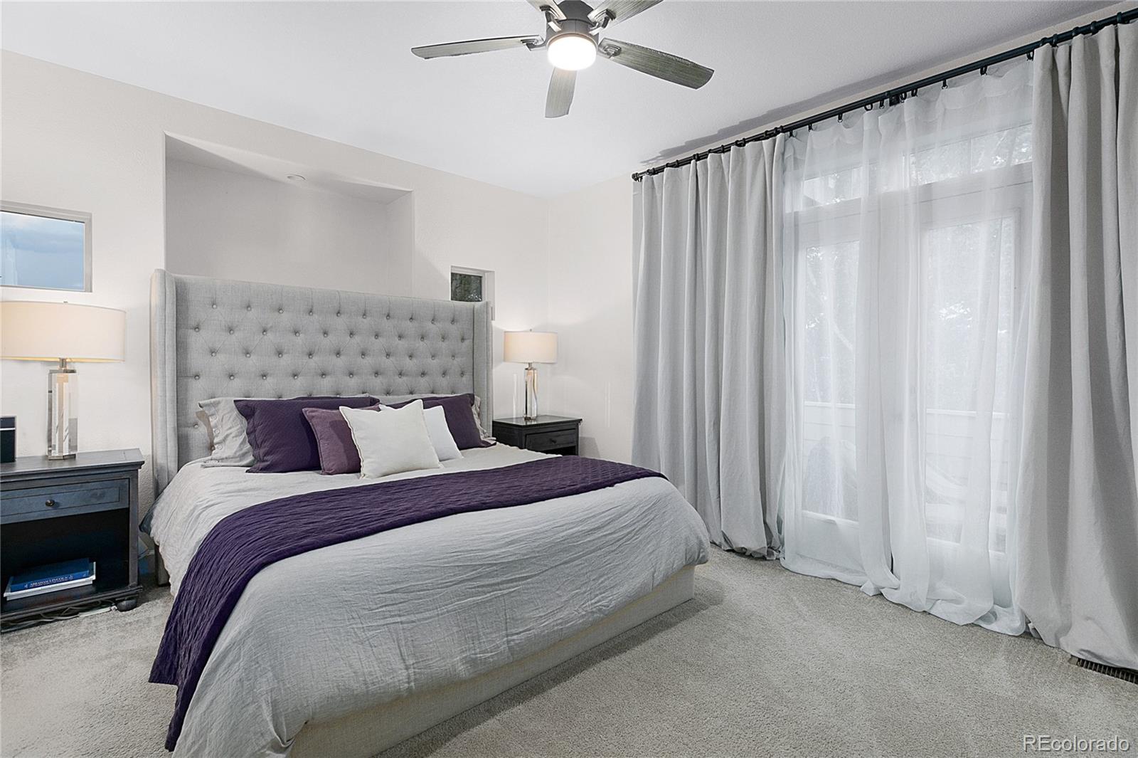 4511 Perry Street Denver, CO 80212 - Photo 14 of 36 a bedroom with a bed and a chandelier