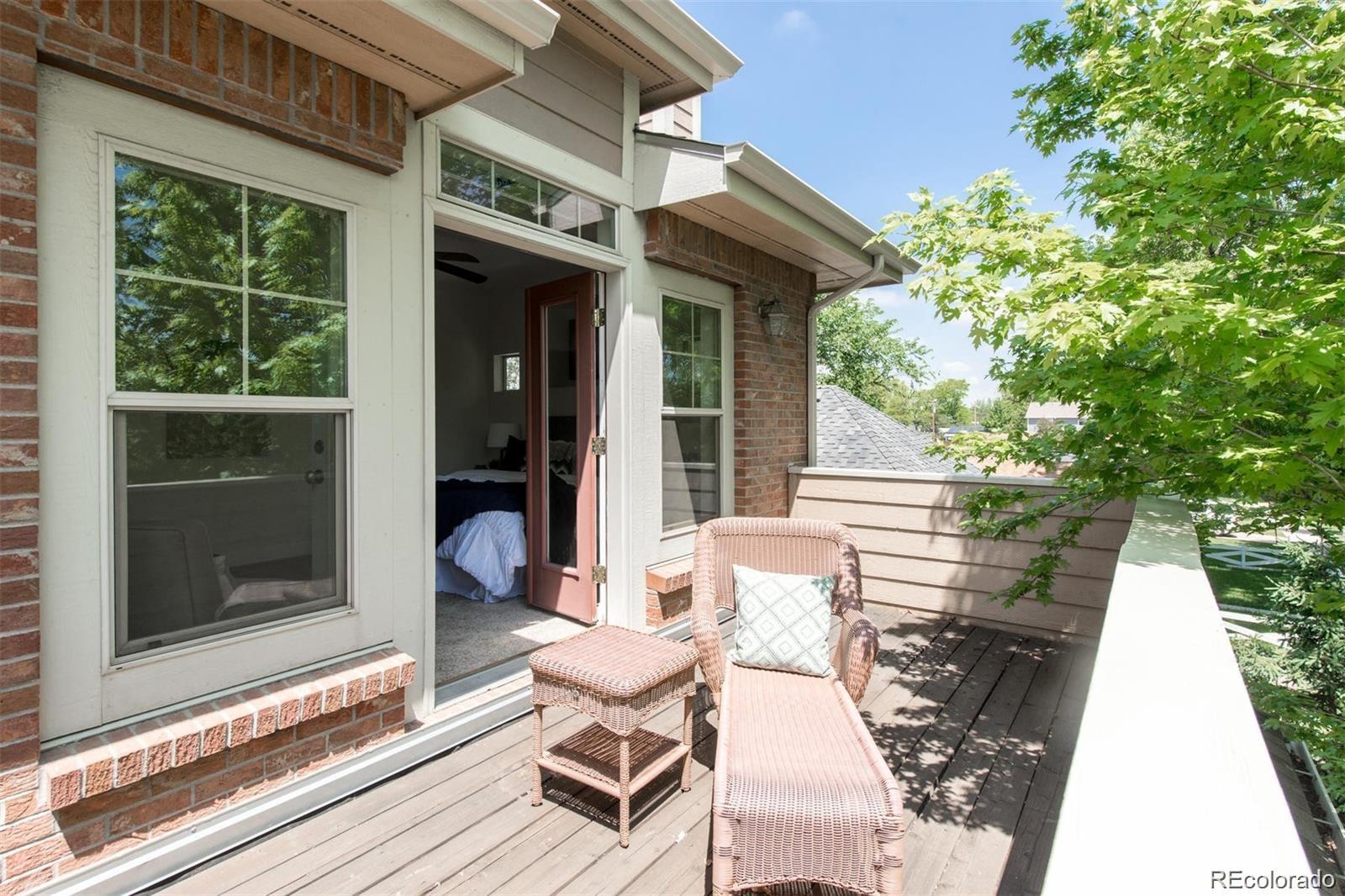 4511 Perry Street Denver, CO 80212 - Photo 15 of 36 a view of a chair and tables in the balcony