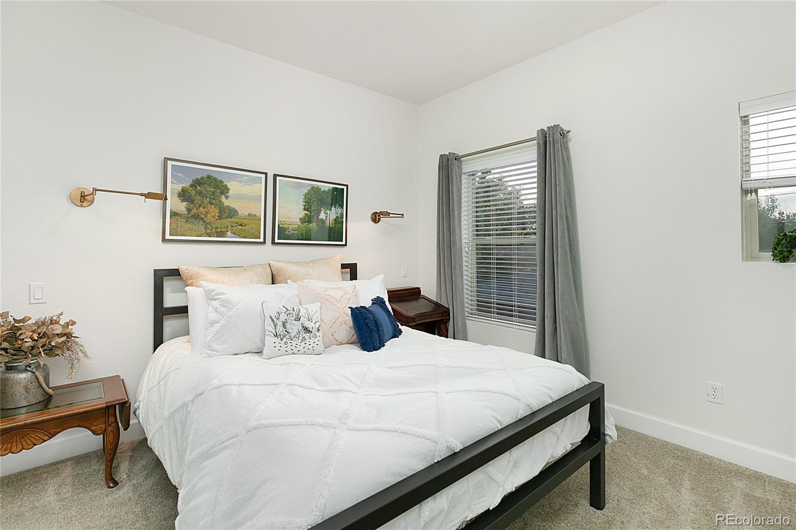 4511 Perry Street Denver, CO 80212 - Photo 17 of 36 a bedroom with a bed and window