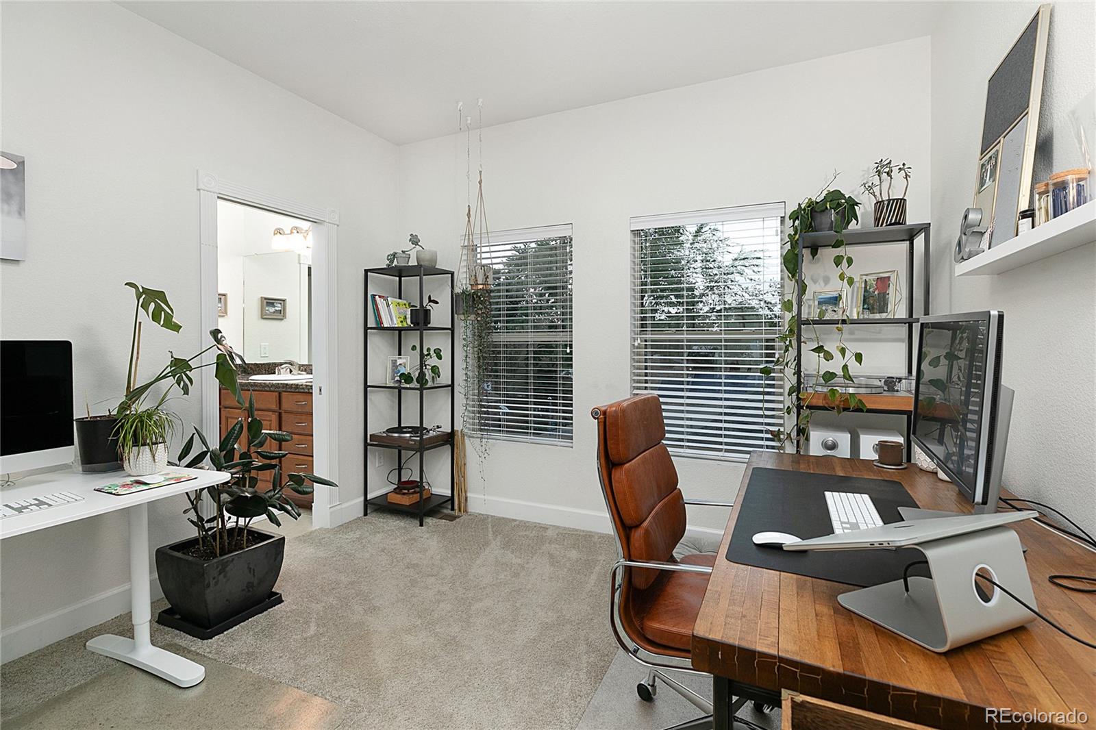 4511 Perry Street Denver, CO 80212 - Photo 19 of 36 a view of a workspace with furniture and a window