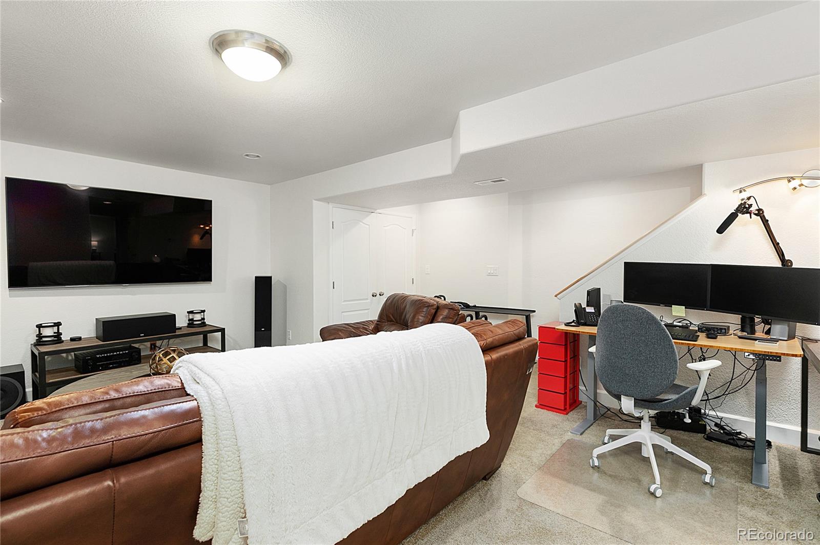 4511 Perry Street Denver, CO 80212 - Photo 20 of 36 a bedroom with a bed and a flat screen tv