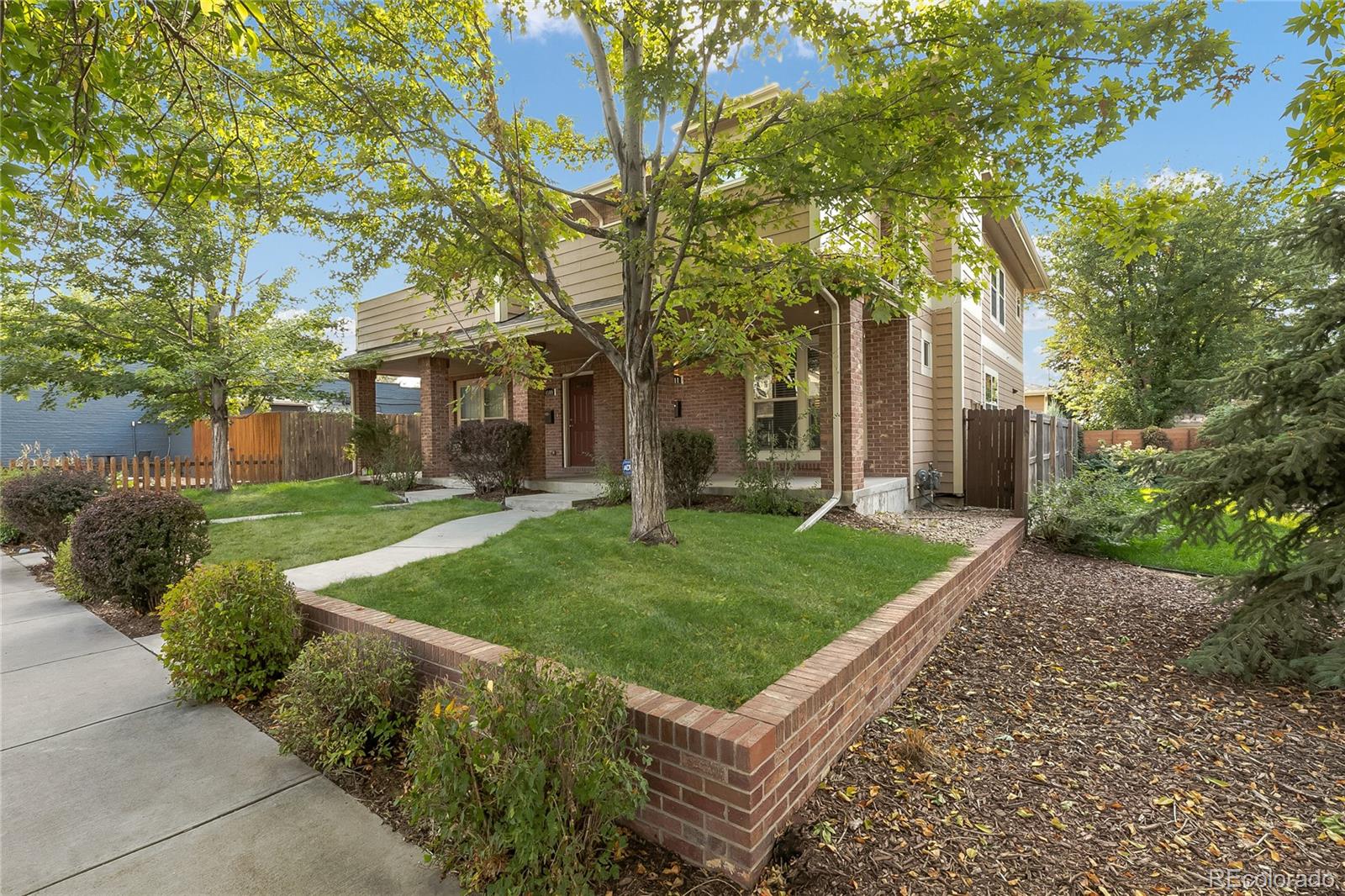 4511 Perry Street Denver, CO 80212 - Photo 2 of 36 front view of a house with a yard