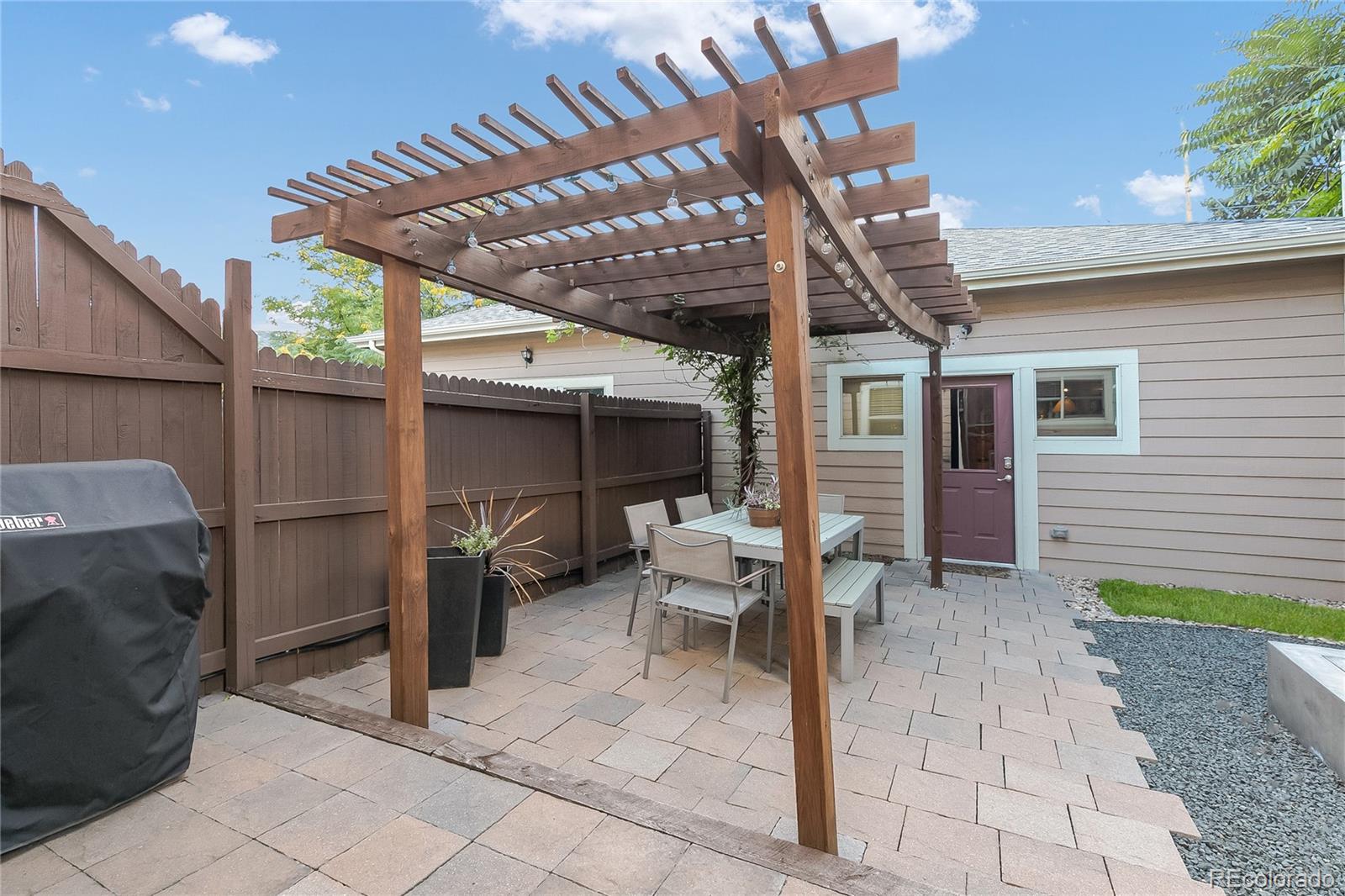 4511 Perry Street Denver, CO 80212 - Photo 24 of 36 a view of a porch with furniture and a yard