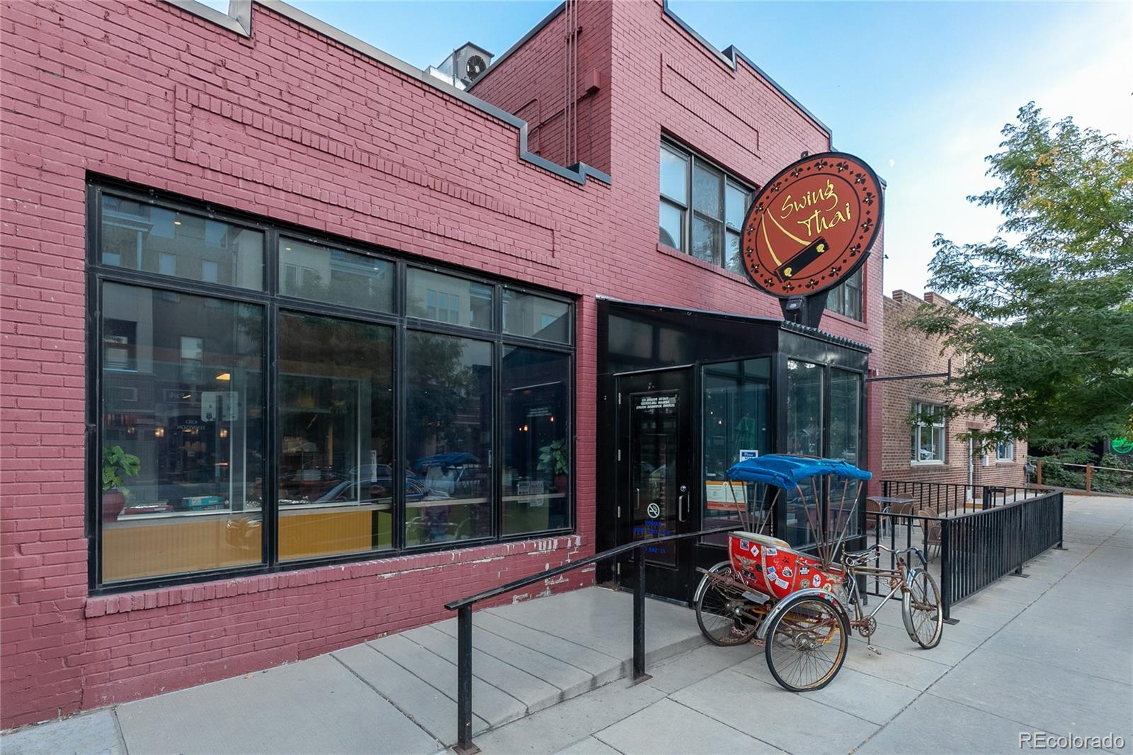 4511 Perry Street Denver, CO 80212 - Photo 31 of 36 a front view of a building with table and chairs