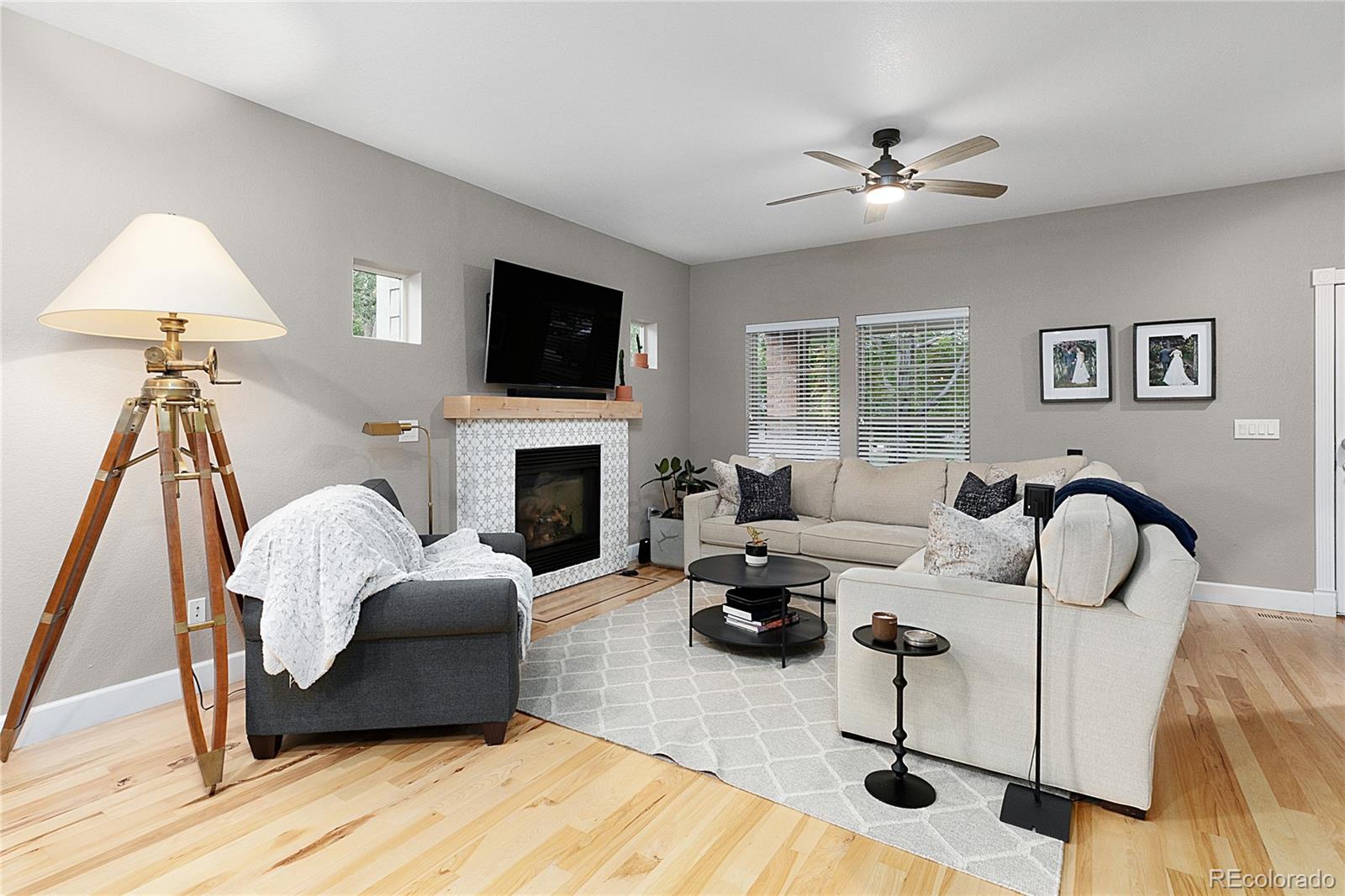 4511 Perry Street Denver, CO 80212 - Photo 5 of 36 a living room with furniture a fireplace and a flat screen tv