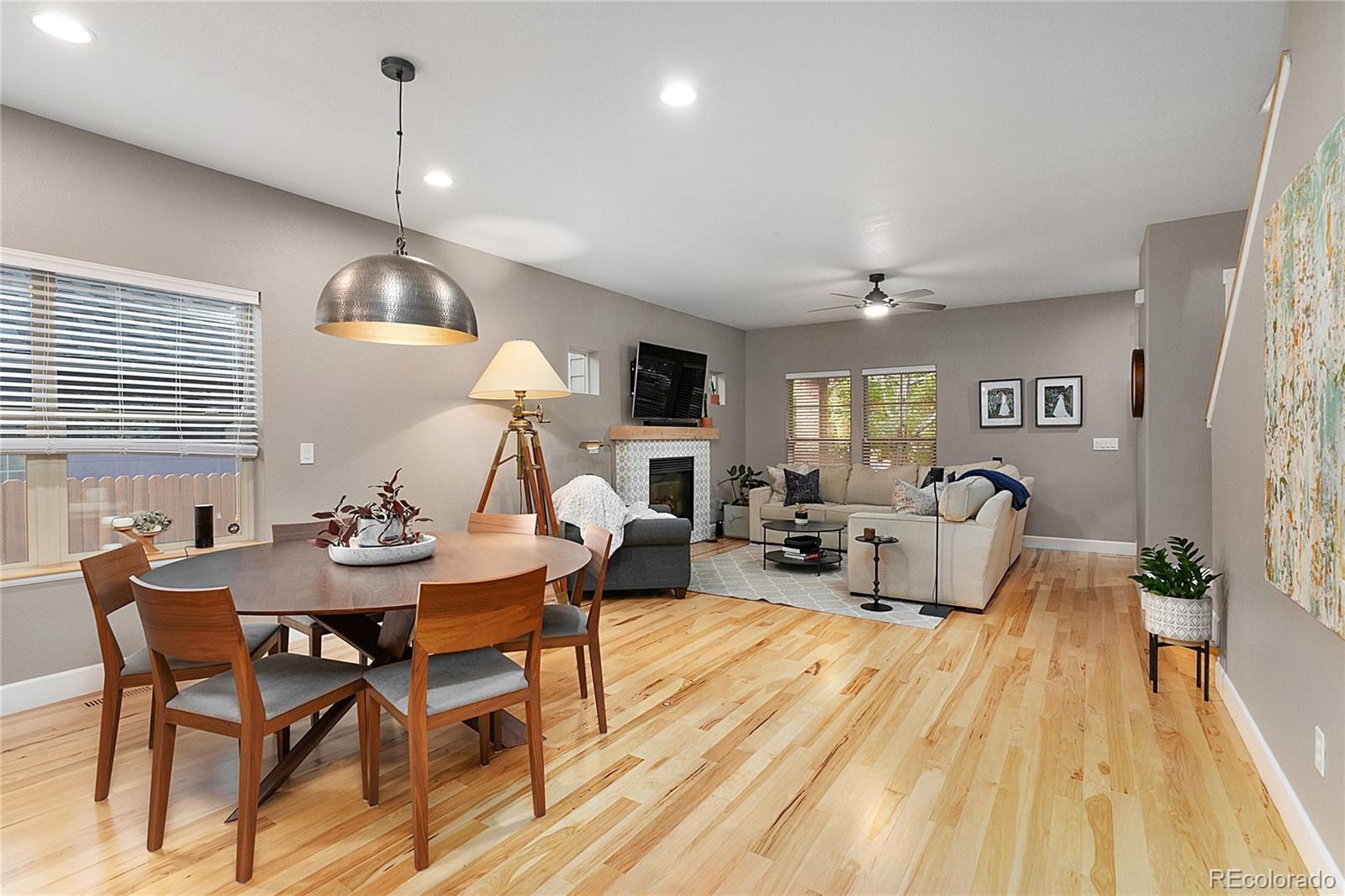 4511 Perry Street Denver, CO 80212 - Photo 7 of 36 a living room with fireplace furniture and a wooden floor