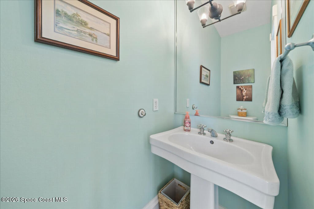 1110 Riverside Drive Titusville, FL 32780 - Photo 32 of 50 a bathroom with a sink and a mirror