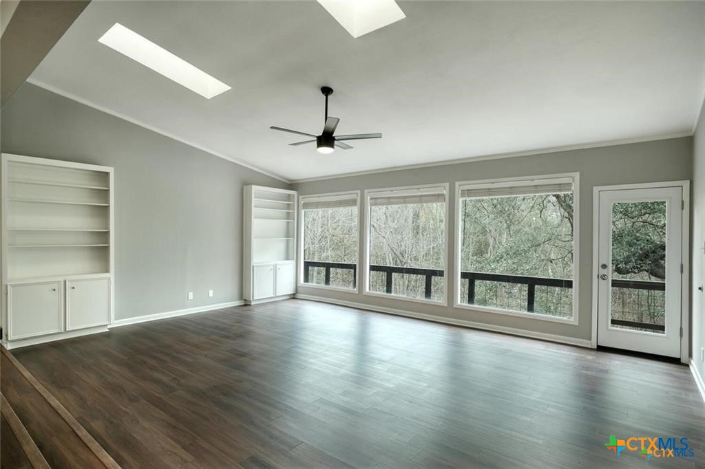 1529 North Colorado Street Lockhart, TX 78644 - Photo 2 of 14 Another view of the living area with plenty of room, and large windows that overlook the beautiful natural and serene view outside.